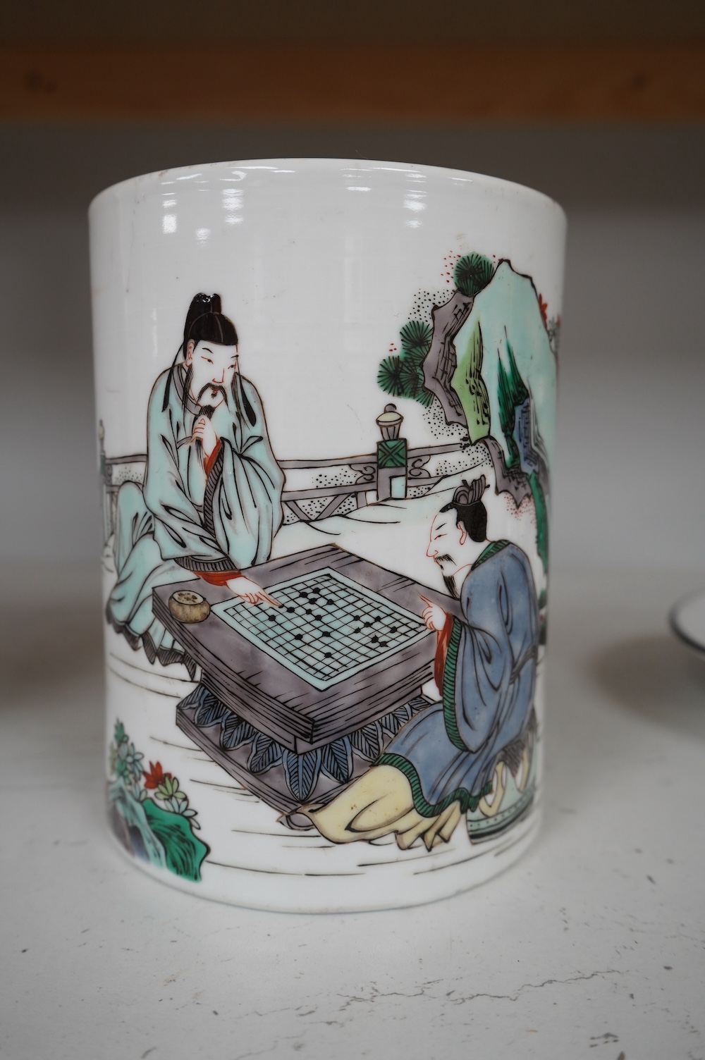 A Chinese famille verte ‘scholars’ brush pot, 15.3cm high